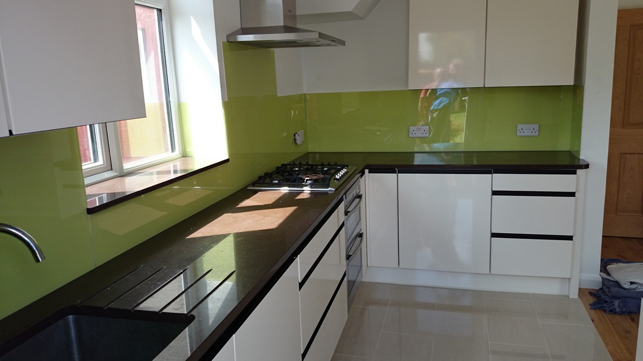 Lime green glass kitchen splashback installed by South Norwood glaziers