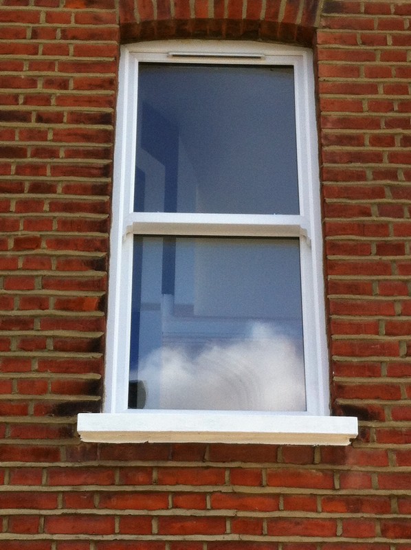 uPVC sash window on Victorian red brick house in South Norwood